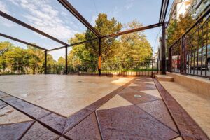 Stamped Concrete Pool Decks: Combining Style and Safety for Your Swimming Oasis