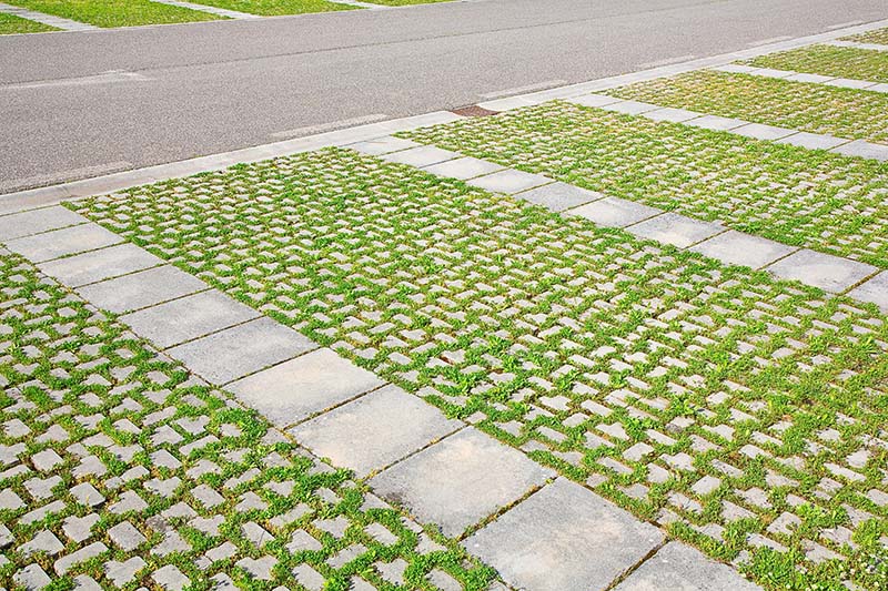Modern Concrete and Grass Driveway: A Blend of Functionality and Aesthetics