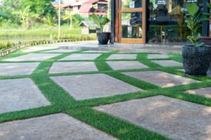 Enhancing Walkways with Concrete Pavers in Grass: A Green and Functional Solution